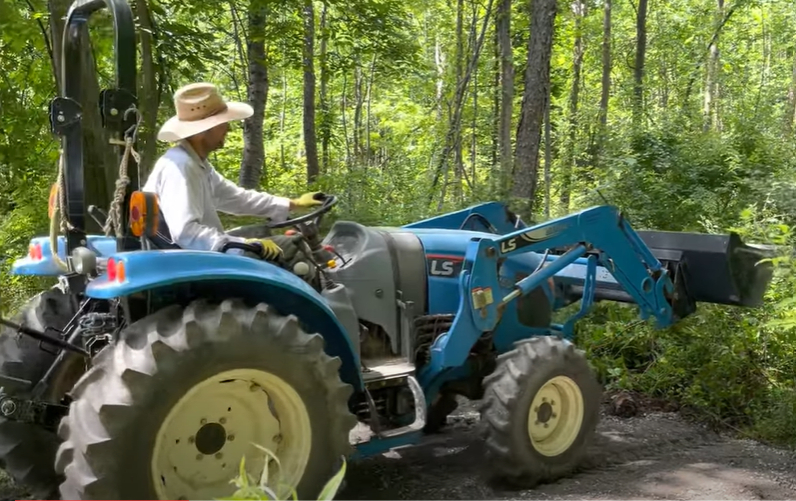 Stonecrop farmer in blue tractor